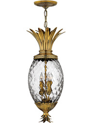 Pineapple Pendant With Clear Optic Glass in Burnished Brass.